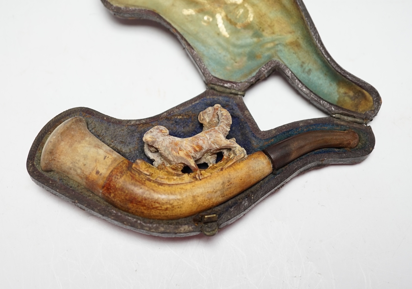 A meerschaum pipe carved with two dogs, cased, 11cm wide